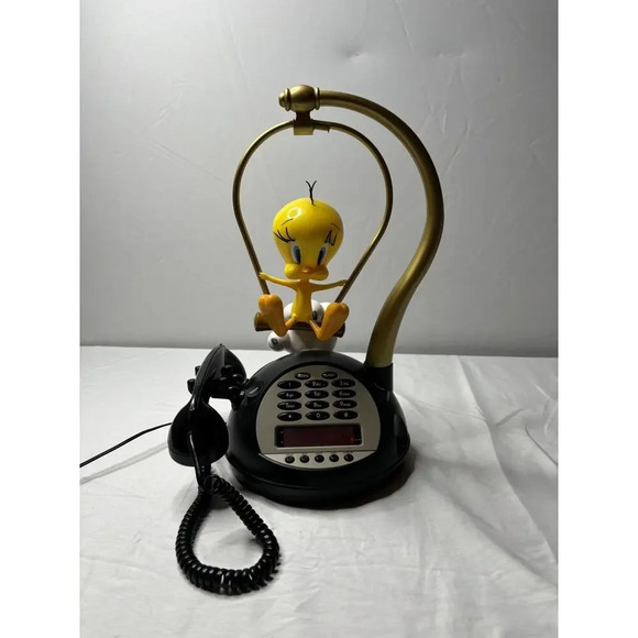 Rare working alarm Tweety bird hand pushing swing.